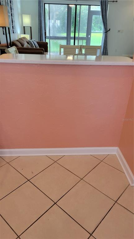 1626 Stickney Point Road, Unit 102 Sarasota, FL 34231 - Photo 5 of 42 an empty room with a window