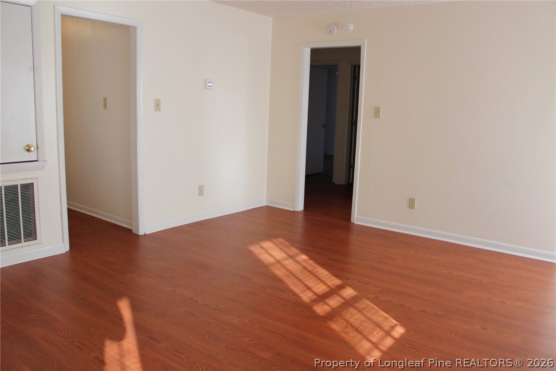7805 Gallant Ridge Drive Fayetteville, NC 28314 - Photo 7 of 25 an empty room with wooden floor and closet