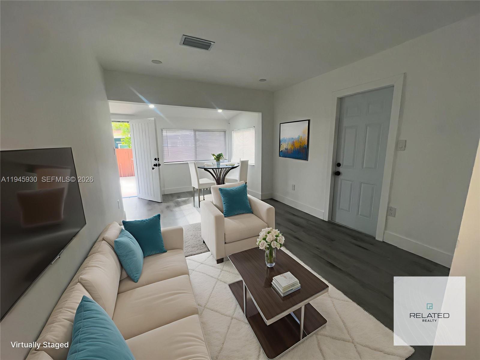 1800 Southwest 3rd Street, Unit D Miami, FL 33135 - Photo 11 of 27 a living room with furniture and a wooden floor