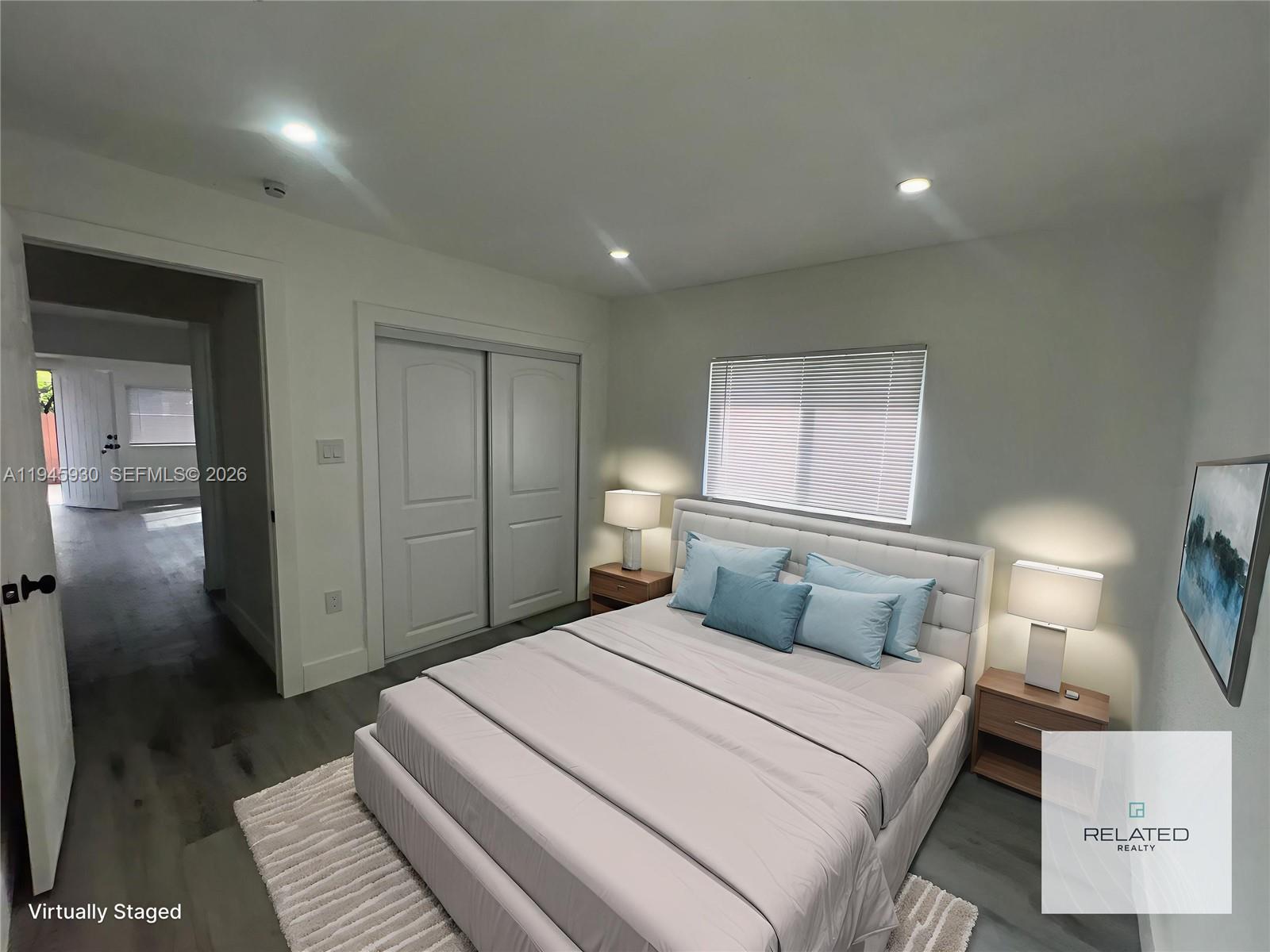 1800 Southwest 3rd Street, Unit D Miami, FL 33135 - Photo 13 of 27 a bedroom with a large bed and a walk in closet