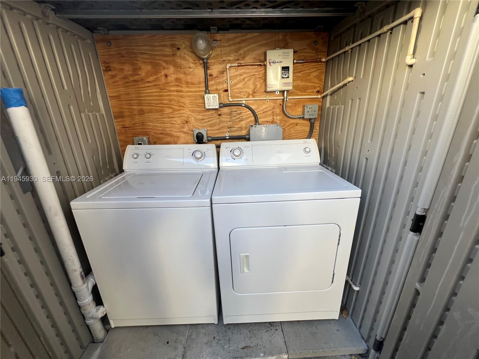 1800 Southwest 3rd Street, Unit D Miami, FL 33135 - Photo 25 of 27 a utility room with dryer and washer
