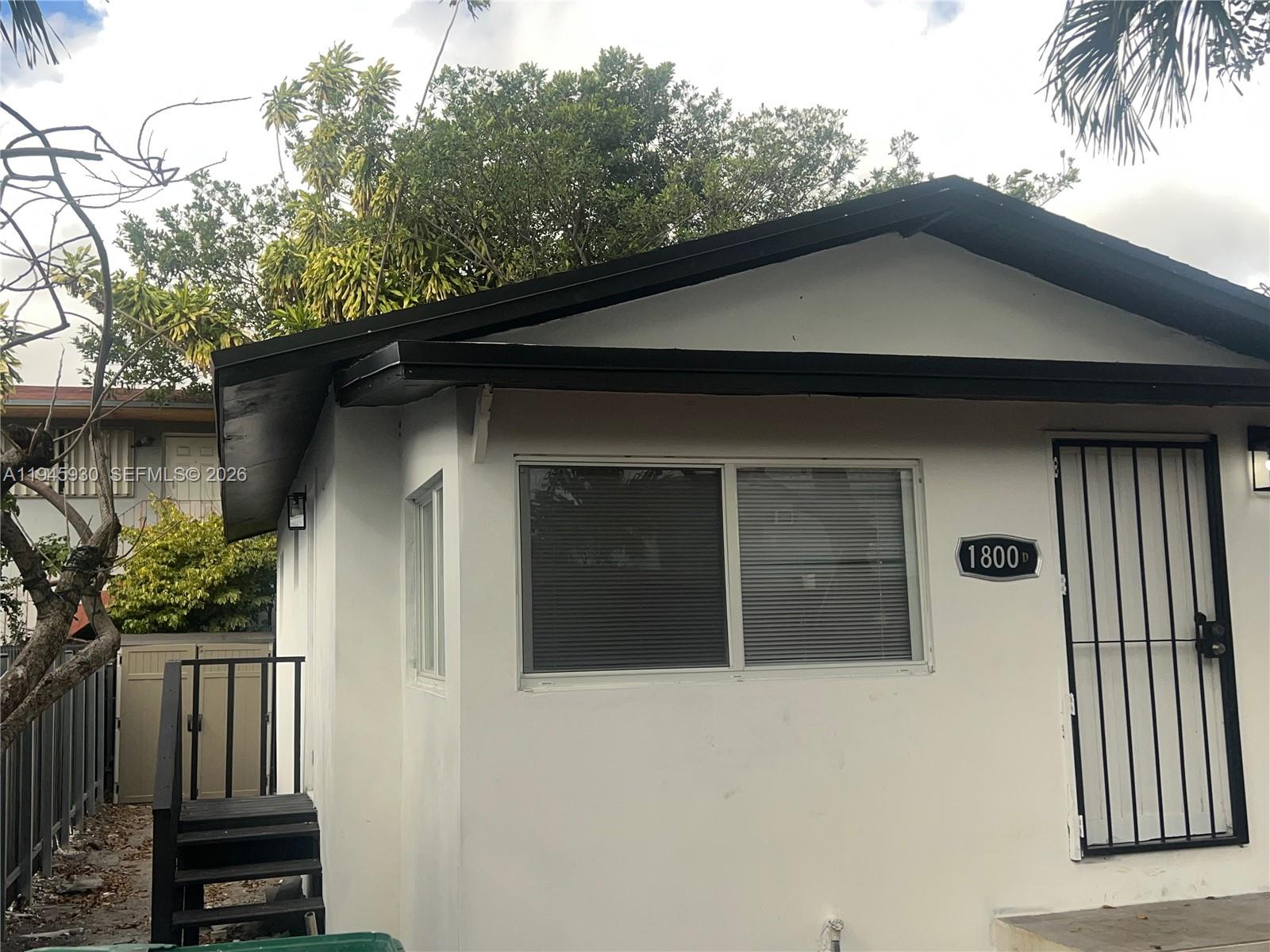 1800 Southwest 3rd Street, Unit D Miami, FL 33135 - Photo 4 of 27 a house that has a tree in front of it