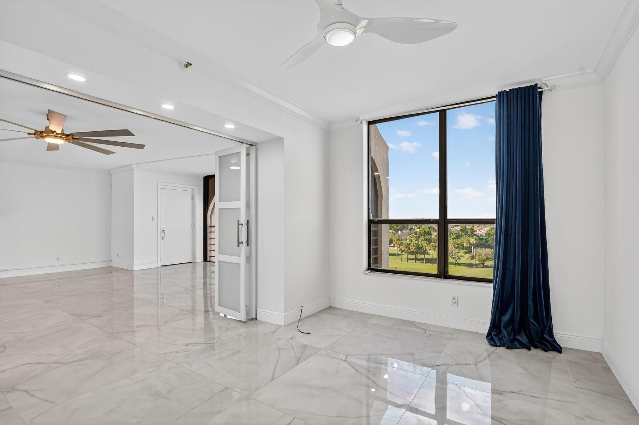 7145 Promenade Drive, Unit C702 Boca Raton, FL 33433 - Photo 15 of 82 a view of an empty room with a window