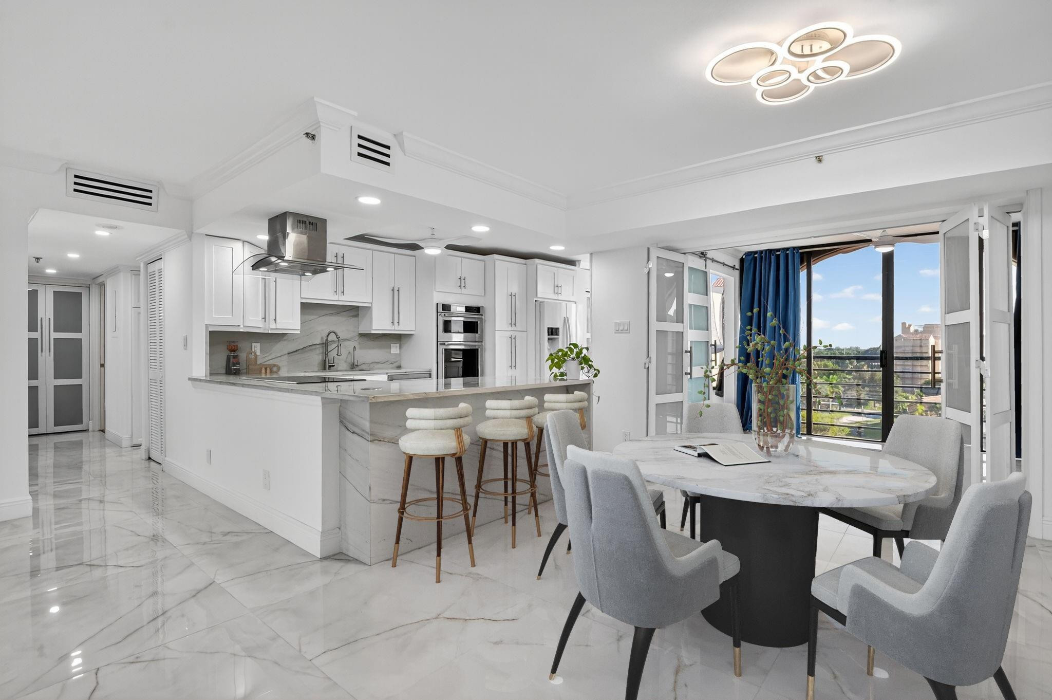 7145 Promenade Drive, Unit C702 Boca Raton, FL 33433 - Photo 23 of 82 a kitchen with a dining table chairs and large windows