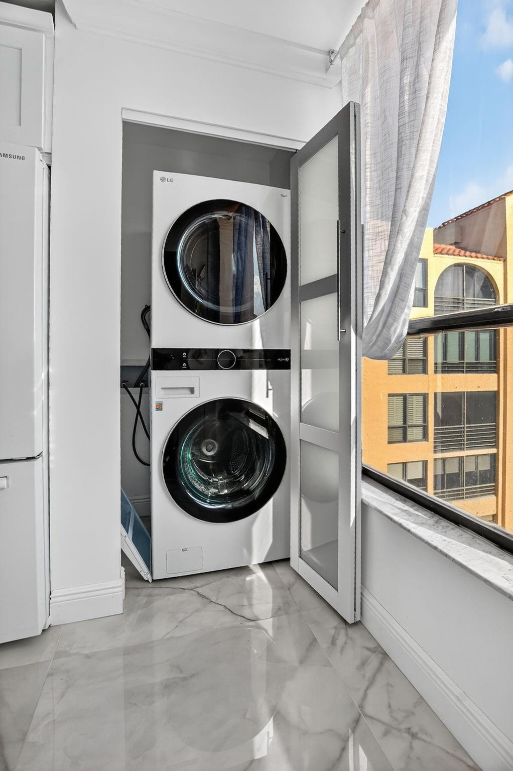 7145 Promenade Drive, Unit C702 Boca Raton, FL 33433 - Photo 33 of 82 a view of a hallway with washer and dryer