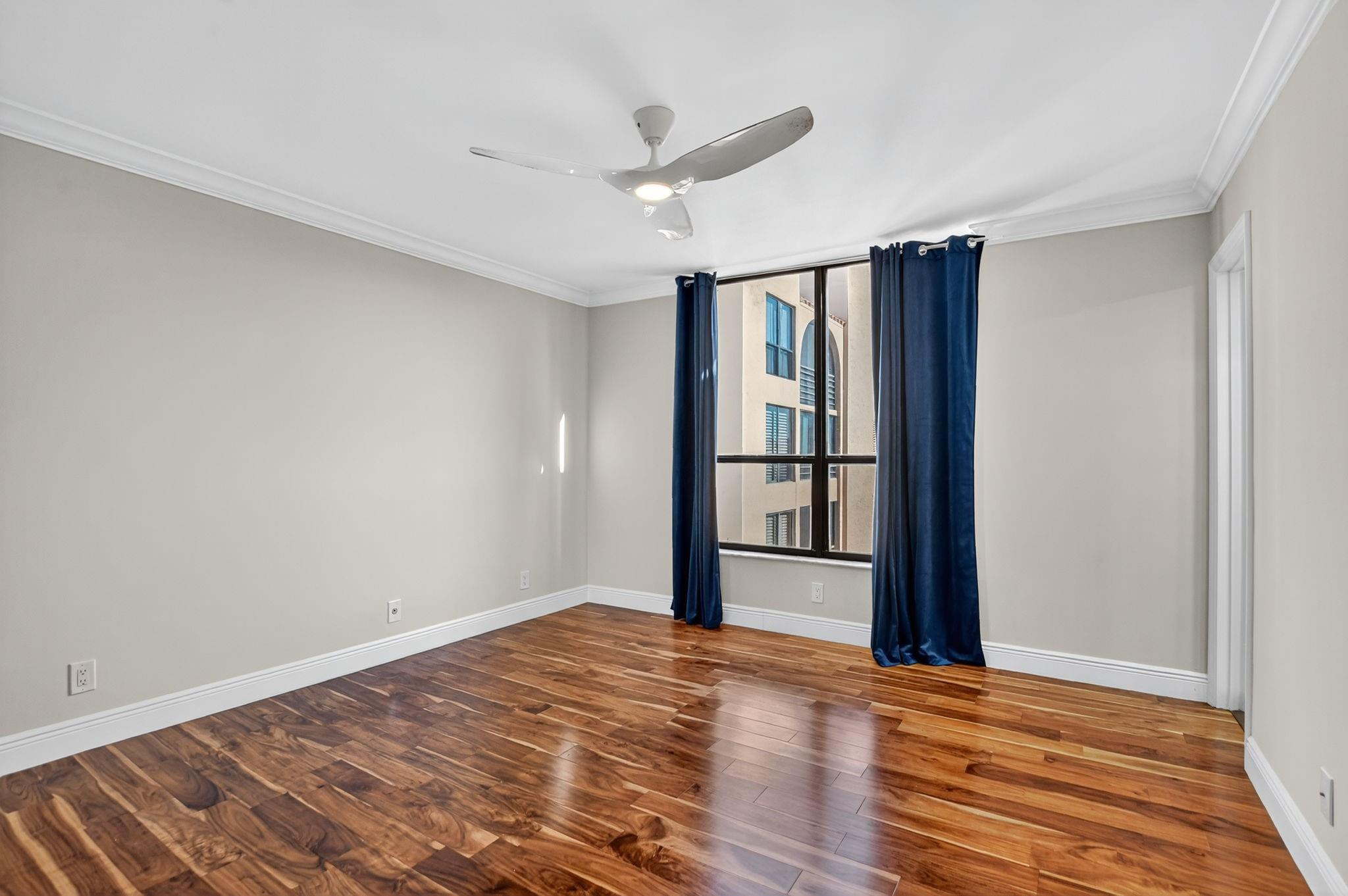 7145 Promenade Drive, Unit C702 Boca Raton, FL 33433 - Photo 40 of 82 a view of empty room with wooden floor and fan