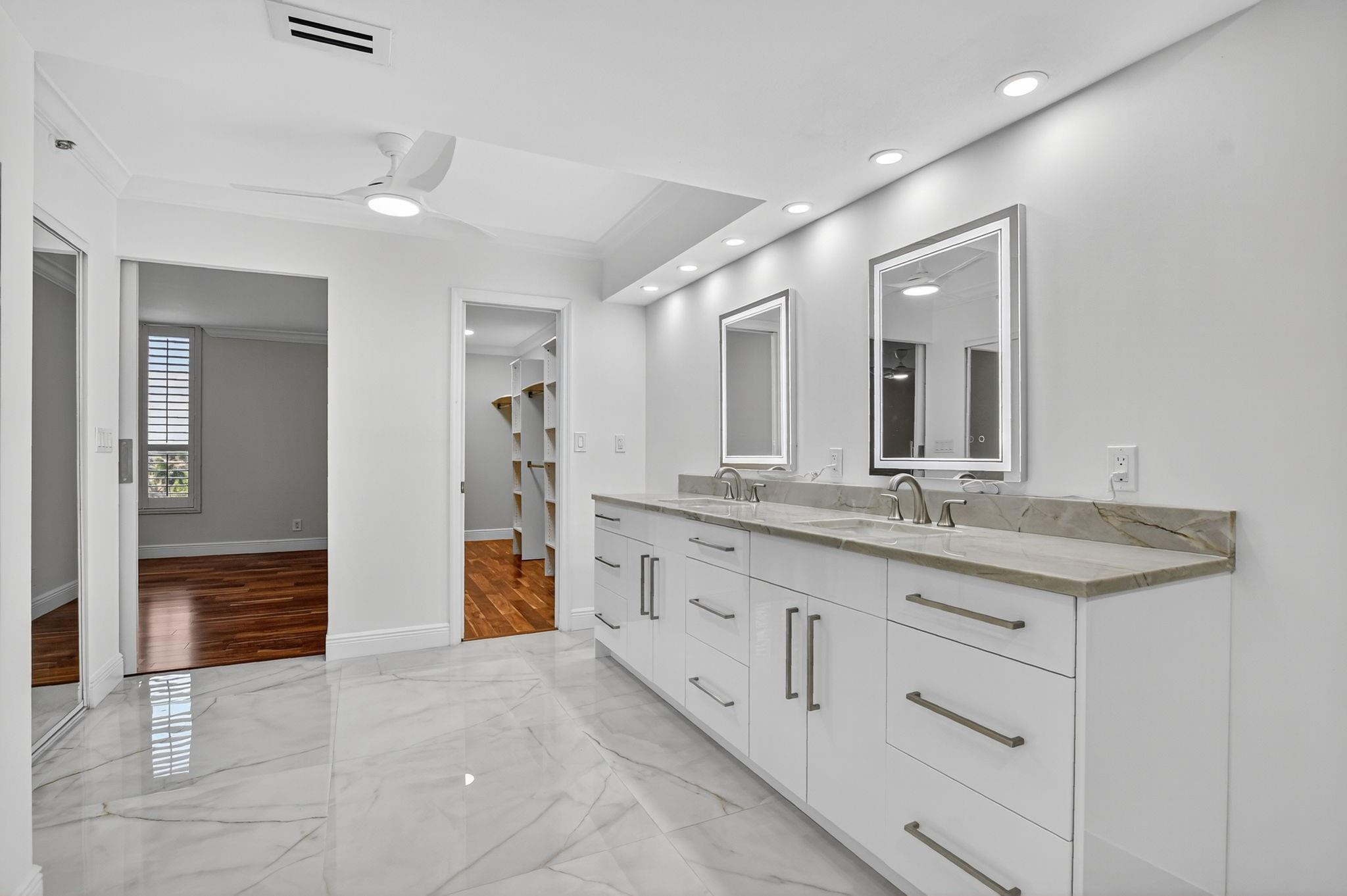 7145 Promenade Drive, Unit C702 Boca Raton, FL 33433 - Photo 53 of 82 a bathroom with double sink and a mirror