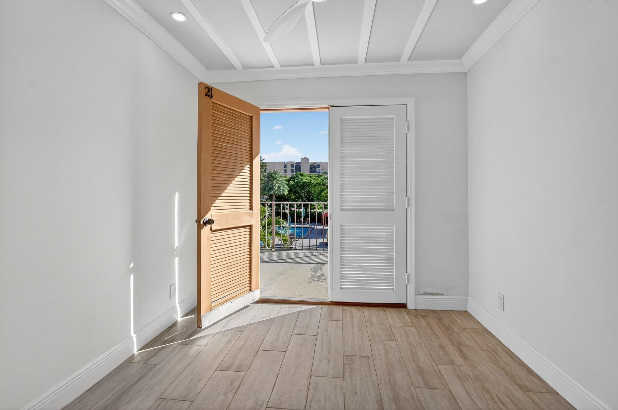 7145 Promenade Drive, Unit C702 Boca Raton, FL 33433 - Photo 78 of 82 wooden floor in an empty room with a window