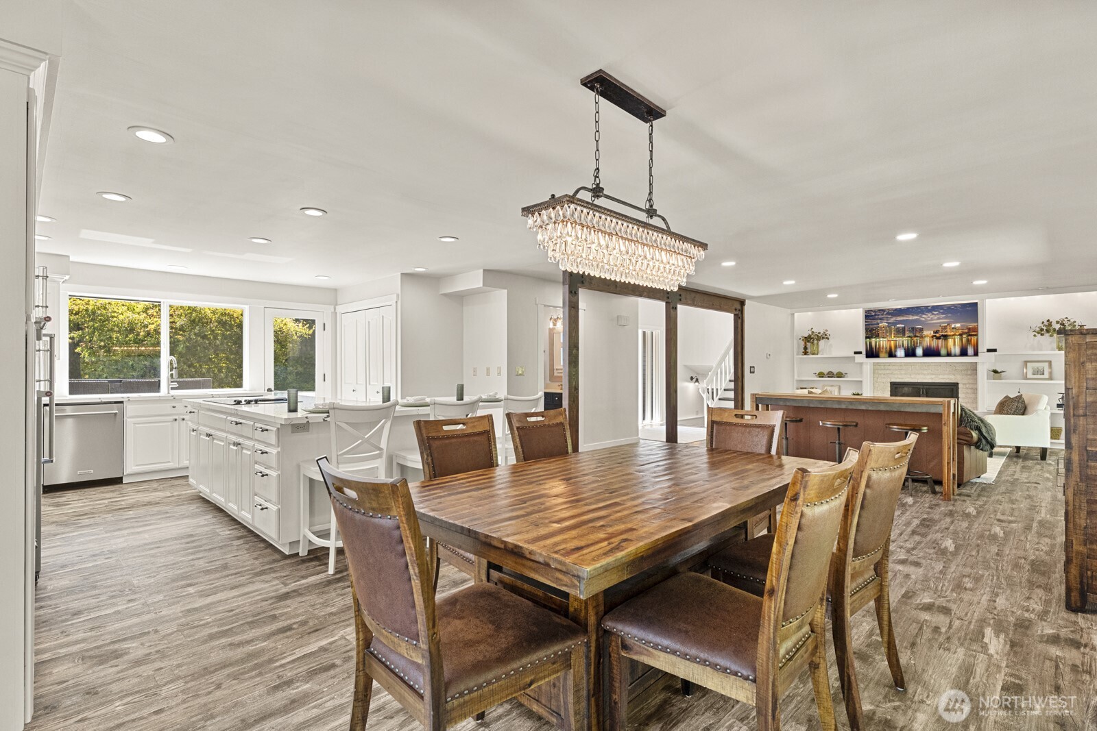 27605 Southeast Issaquah-Fall City Road Fall City, WA 98024 - Photo 11 of 39 a dining room with furniture a window and wooden floor