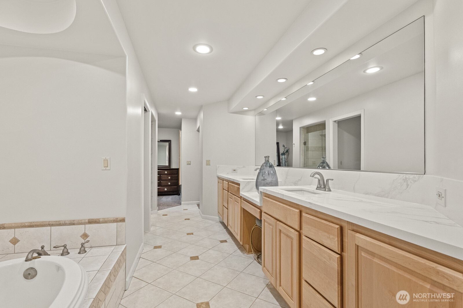 27605 Southeast Issaquah-Fall City Road Fall City, WA 98024 - Photo 17 of 39 a spacious bathroom with a double vanity sink and a bathtub