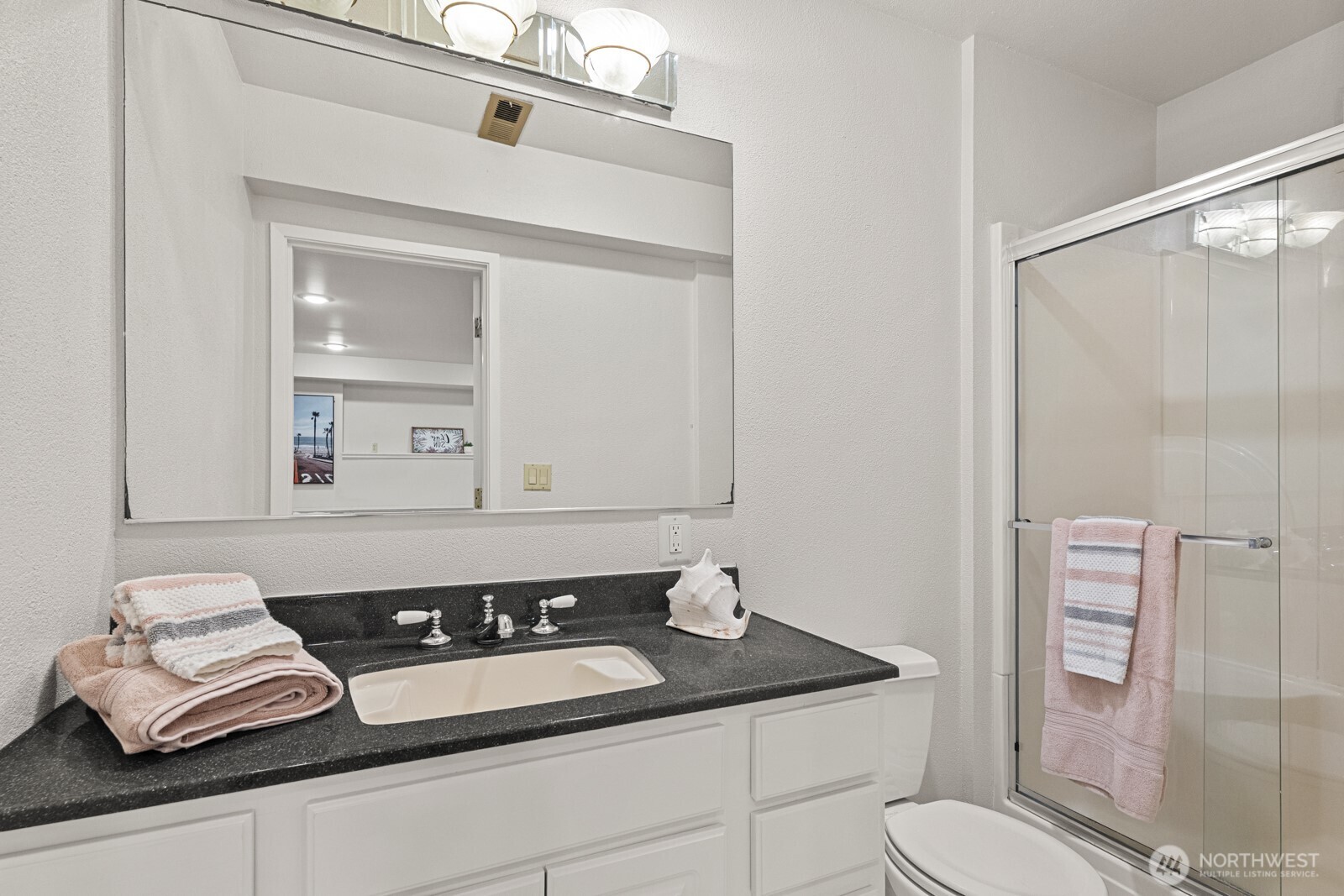 27605 Southeast Issaquah-Fall City Road Fall City, WA 98024 - Photo 19 of 39 a bathroom with a granite countertop sink and a mirror