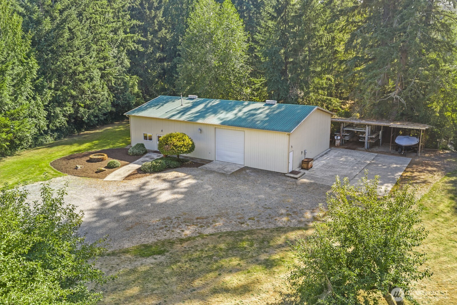 27605 Southeast Issaquah-Fall City Road Fall City, WA 98024 - Photo 2 of 39 a wooden bench sitting in the middle of a yard
