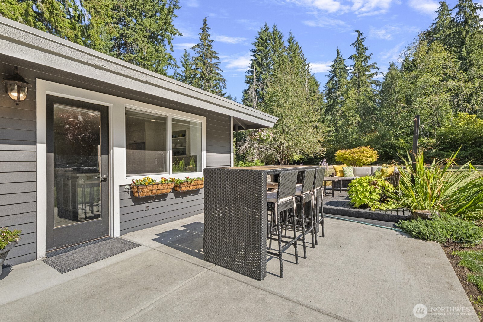 27605 Southeast Issaquah-Fall City Road Fall City, WA 98024 - Photo 21 of 39 a view of a patio with a table and chairs