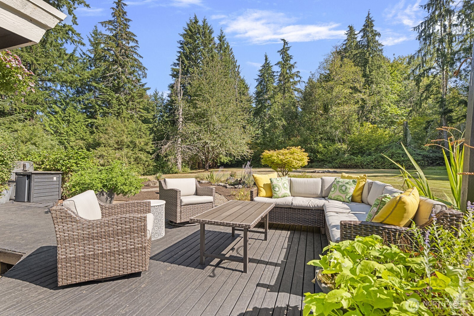27605 Southeast Issaquah-Fall City Road Fall City, WA 98024 - Photo 22 of 39 a view of a patio with couches chairs and a potted plant