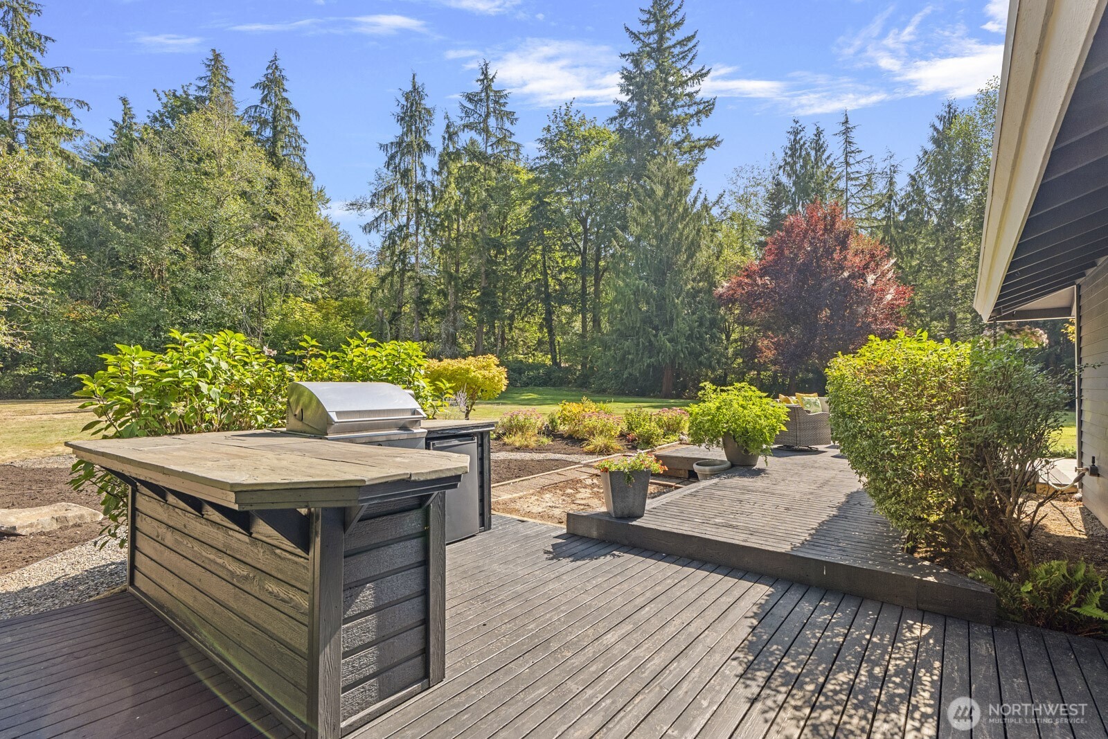 27605 Southeast Issaquah-Fall City Road Fall City, WA 98024 - Photo 23 of 39 a view of a patio with table and chairs and potted plants