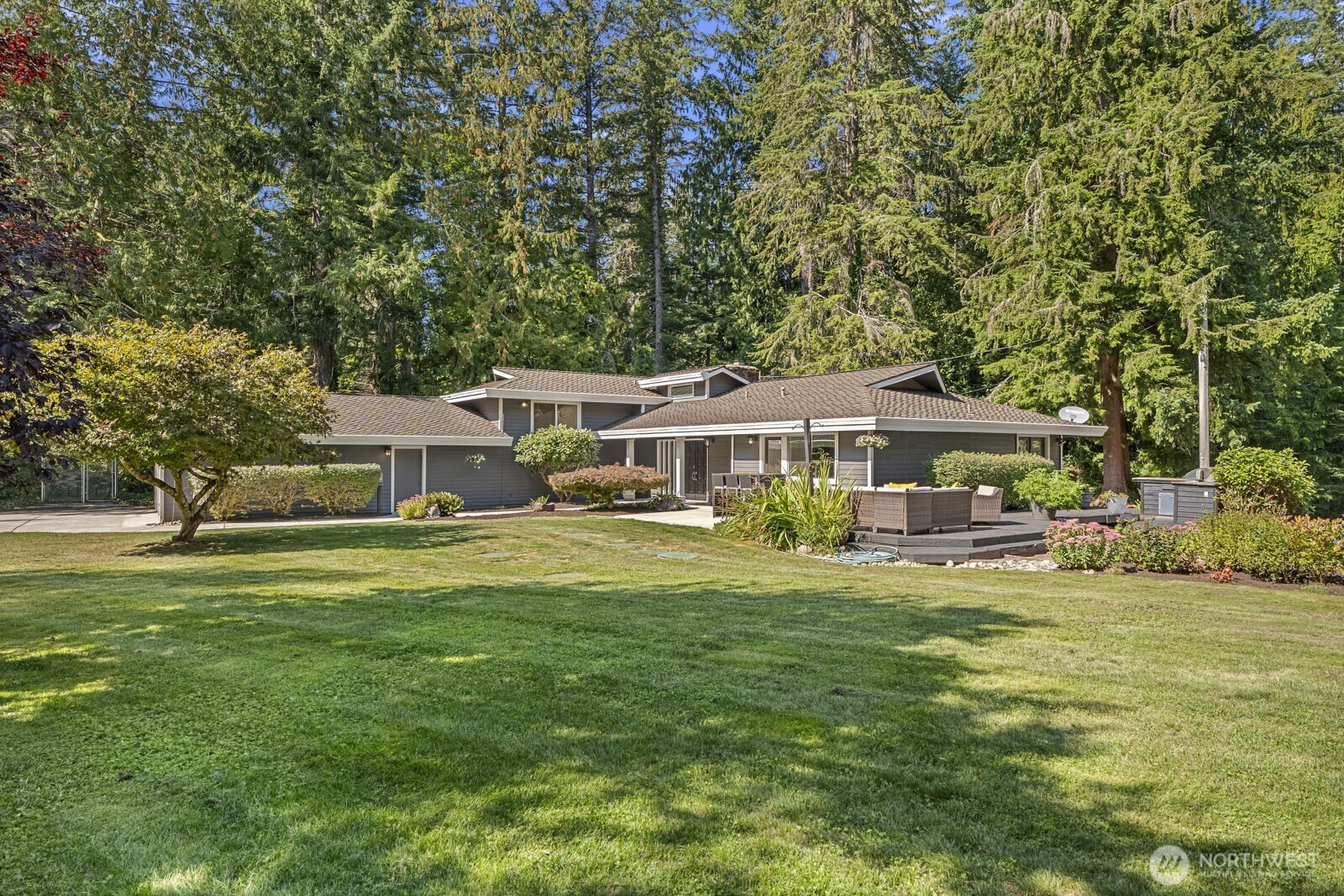 27605 Southeast Issaquah-Fall City Road Fall City, WA 98024 - Photo 24 of 39 a front view of a house with a garden