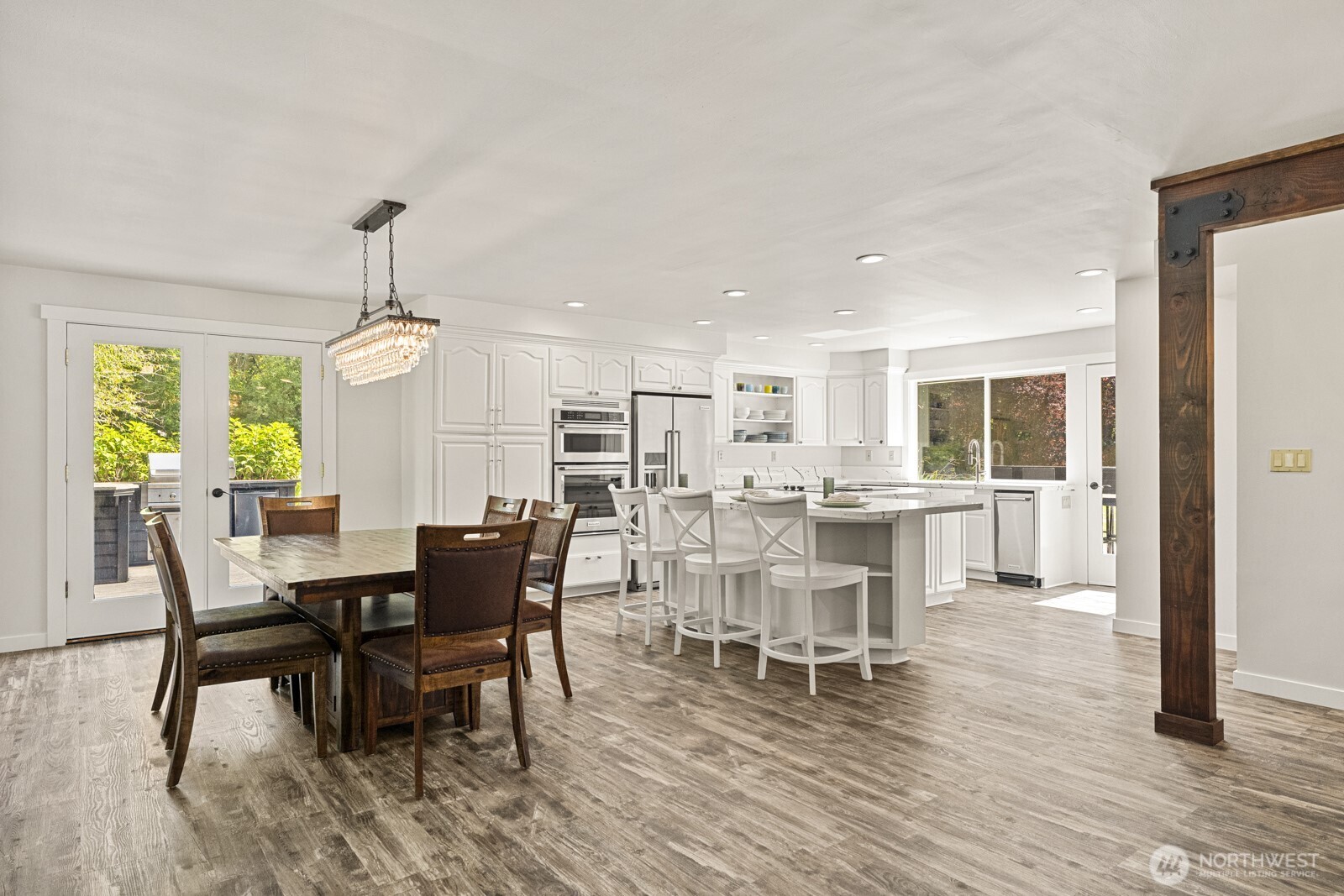 27605 Southeast Issaquah-Fall City Road Fall City, WA 98024 - Photo 6 of 39 a view of a dining room with furniture window and wooden floor
