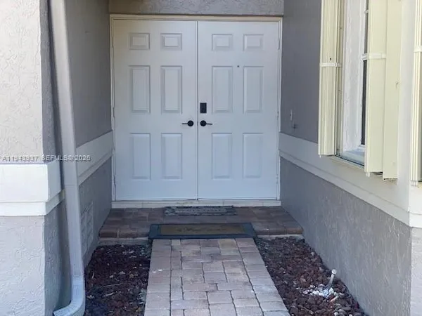 a view of a door with wooden floor