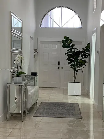 a bathroom with a sink a mirror and a shower