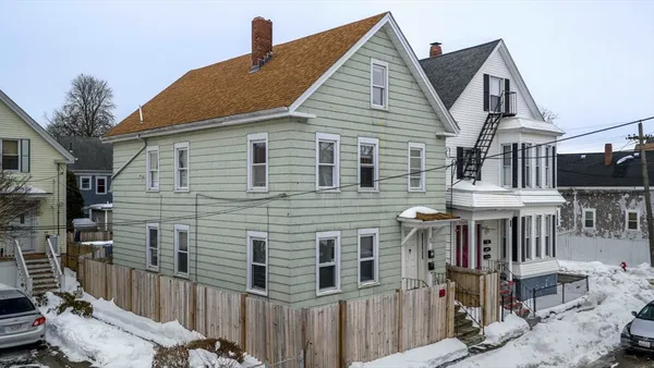 a front view of a house with glass windows