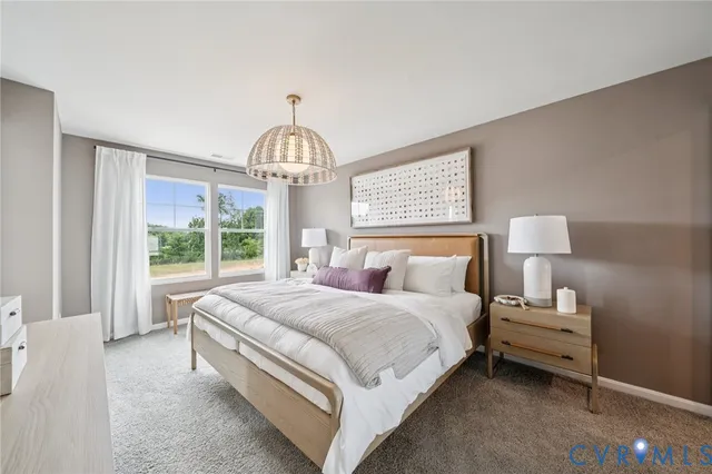 a bedroom with bed and window