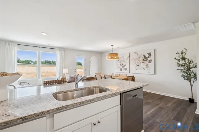 a kitchen with a sink and large window