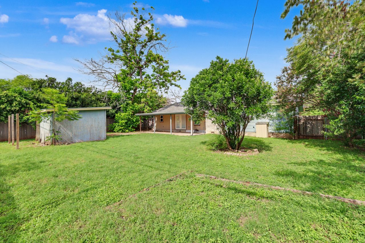 1811 Terry Lane Georgetown, TX 78628 - Photo 39 of 40 A spacious, verdant yard with mature trees offers privacy and ample outdoor enjoyment.