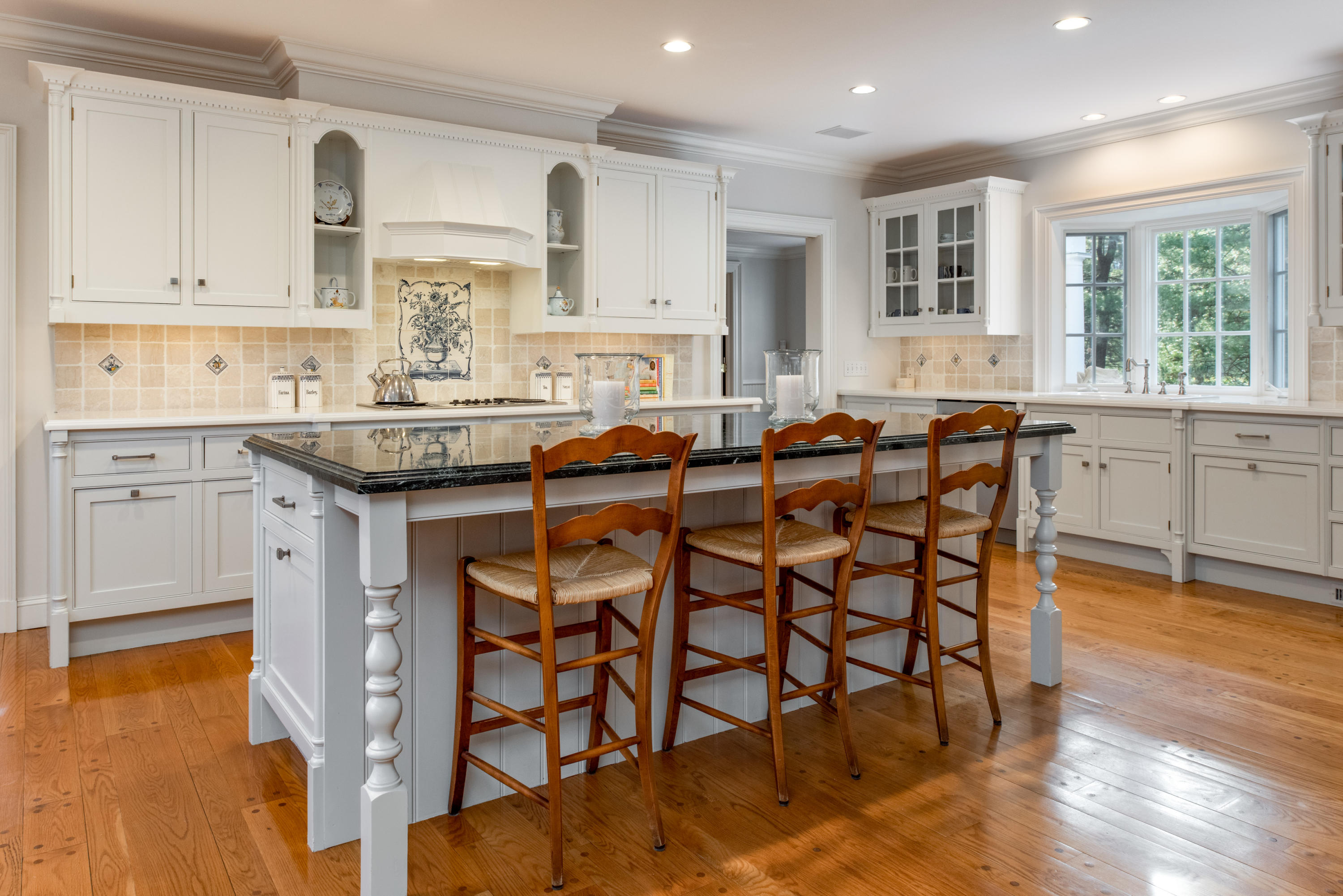 41 St Nicholas Road Darien, CT 06820 - Photo 12 of 39 a kitchen with stainless steel appliances granite countertop counter top space a sink cabinets and a window
