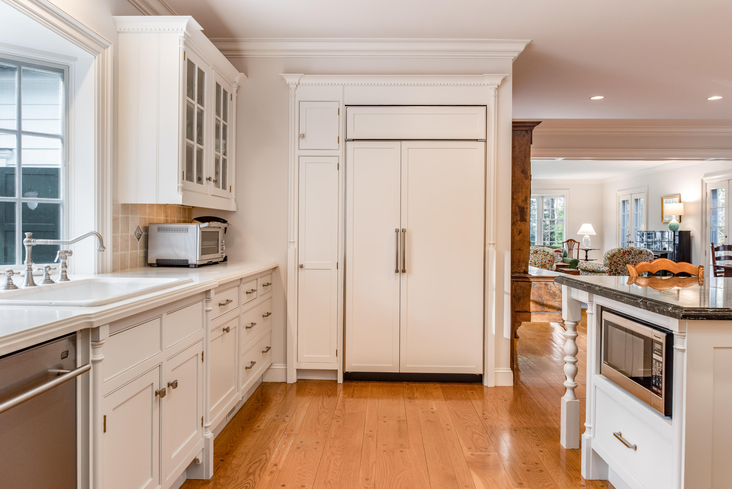 41 St Nicholas Road Darien, CT 06820 - Photo 16 of 39 a kitchen with granite countertop white cabinets and white appliances