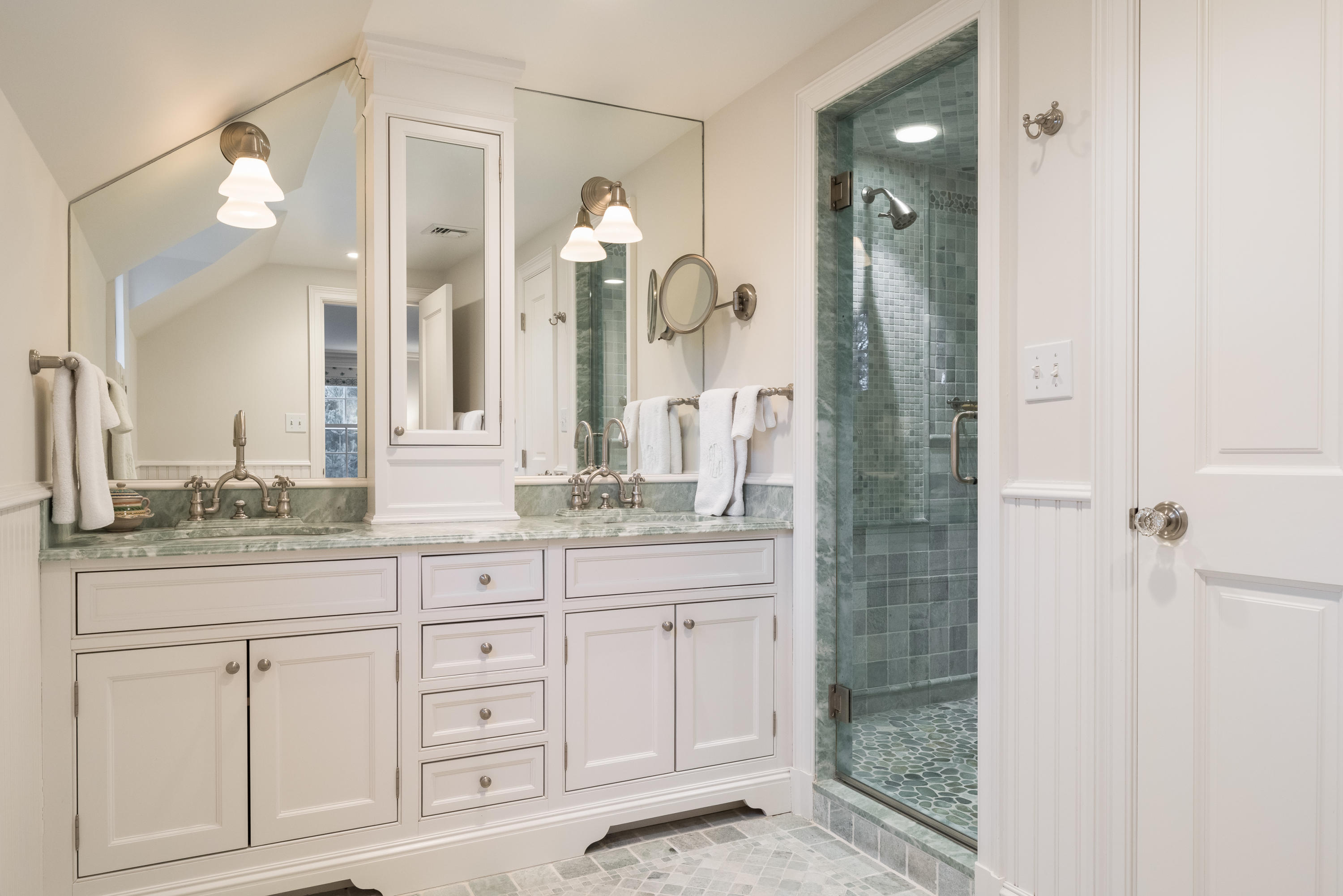 41 St Nicholas Road Darien, CT 06820 - Photo 23 of 39 a bathroom with a granite countertop sink a mirror and a shower