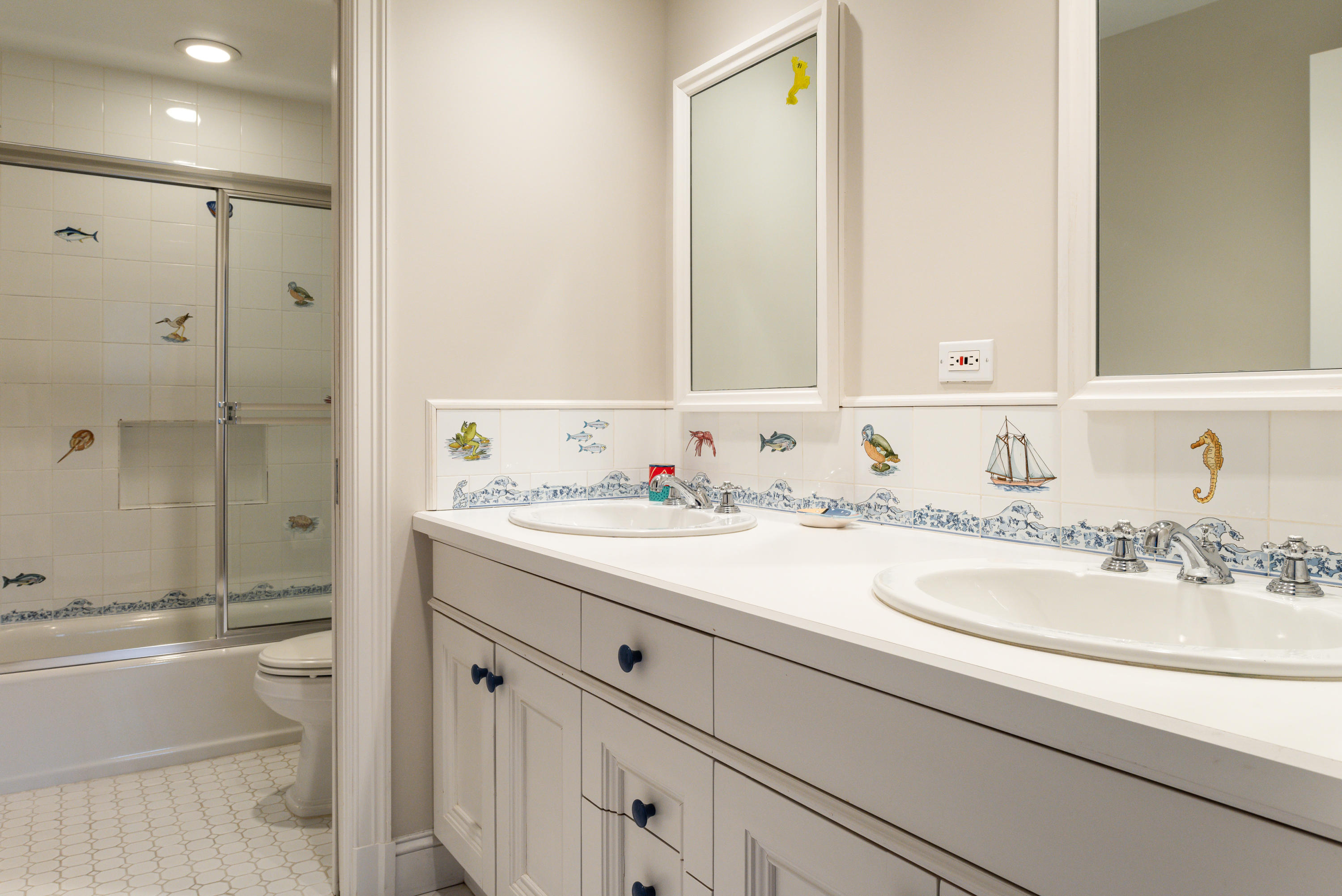 41 St Nicholas Road Darien, CT 06820 - Photo 27 of 39 a bathroom with a granite countertop sink mirror and double