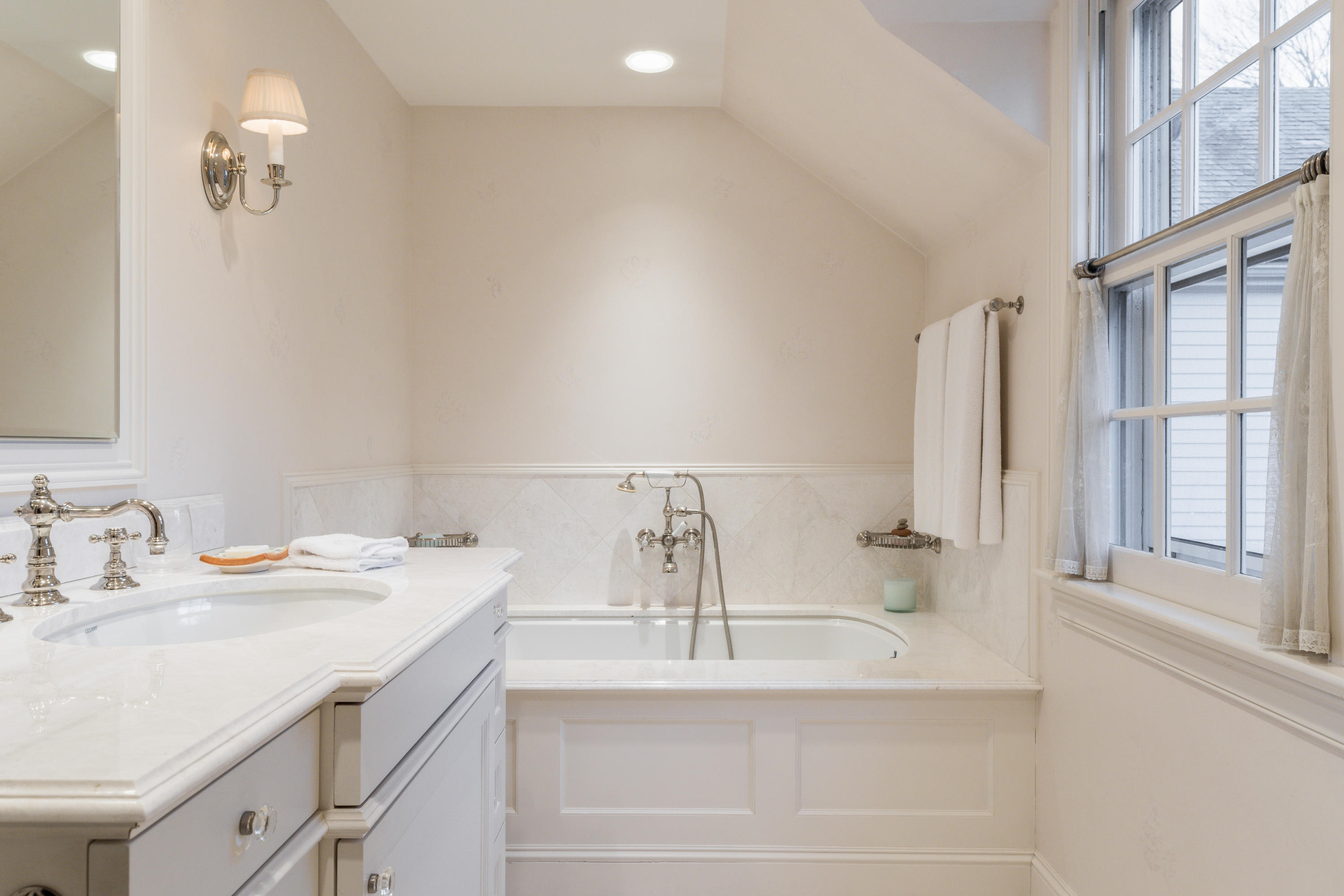 41 St Nicholas Road Darien, CT 06820 - Photo 29 of 39 a bathroom with a sink and a mirror