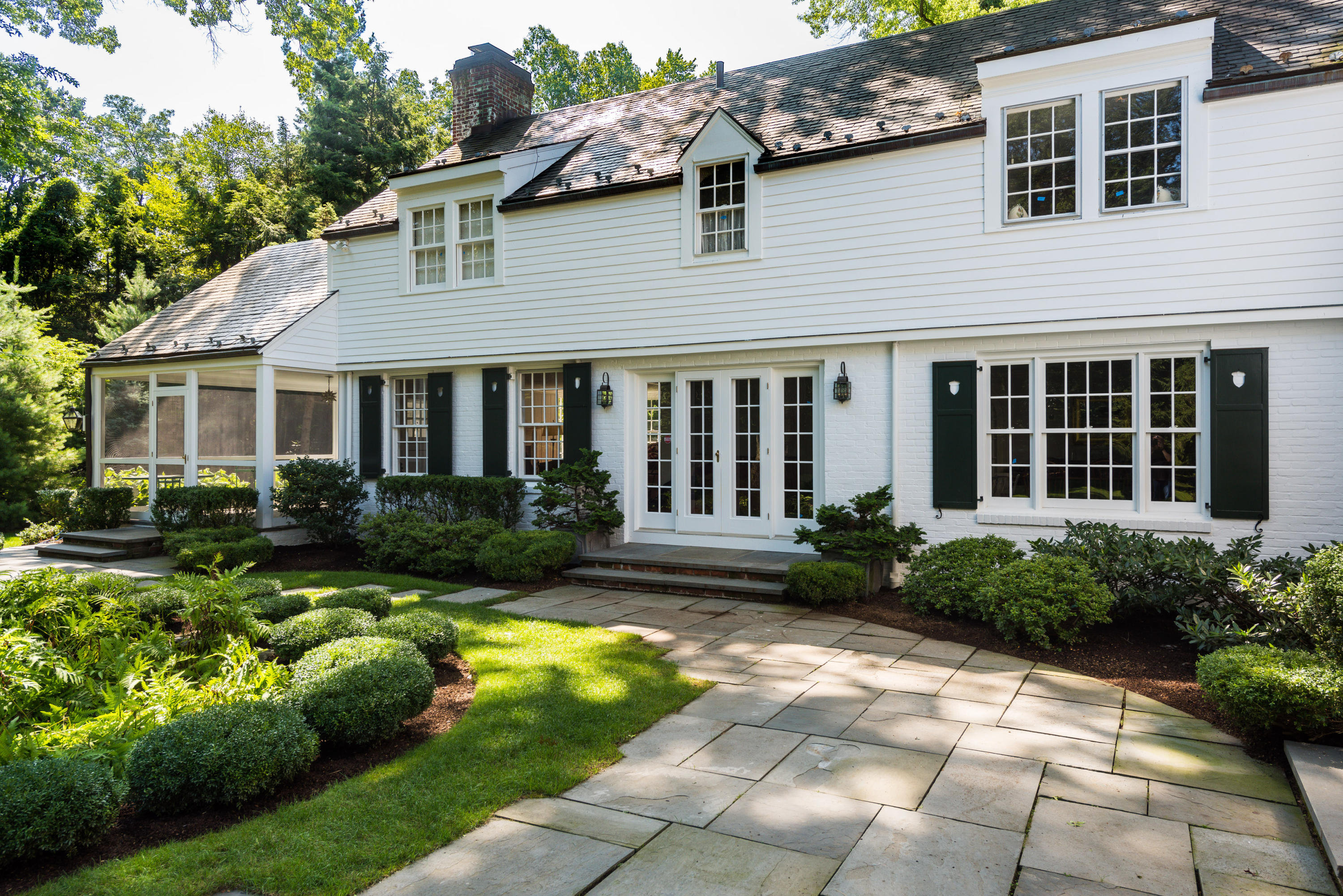 41 St Nicholas Road Darien, CT 06820 - Photo 35 of 39 a front view of a house with garden and porch