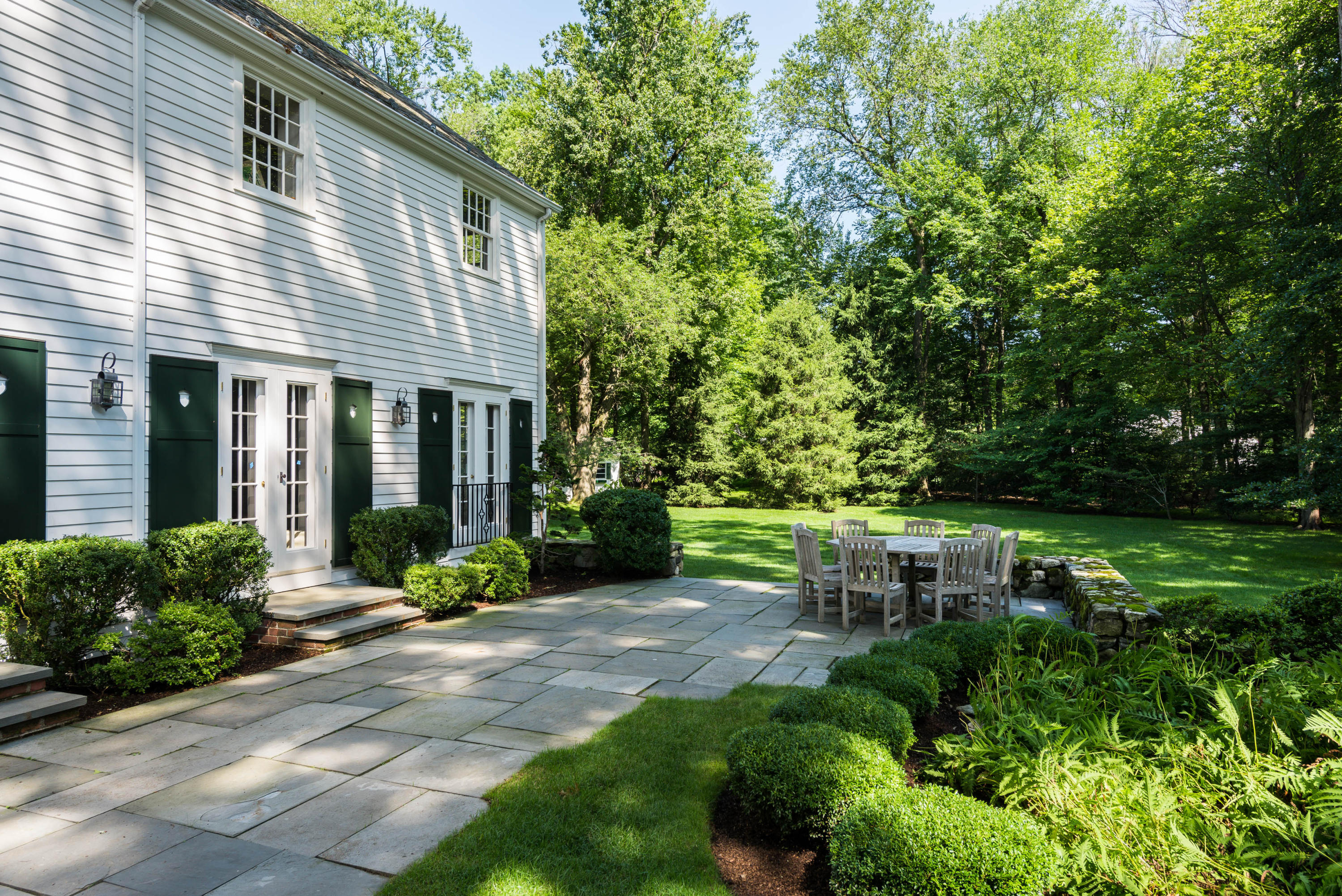 41 St Nicholas Road Darien, CT 06820 - Photo 36 of 39 a view of a house with backyard sitting area and garden