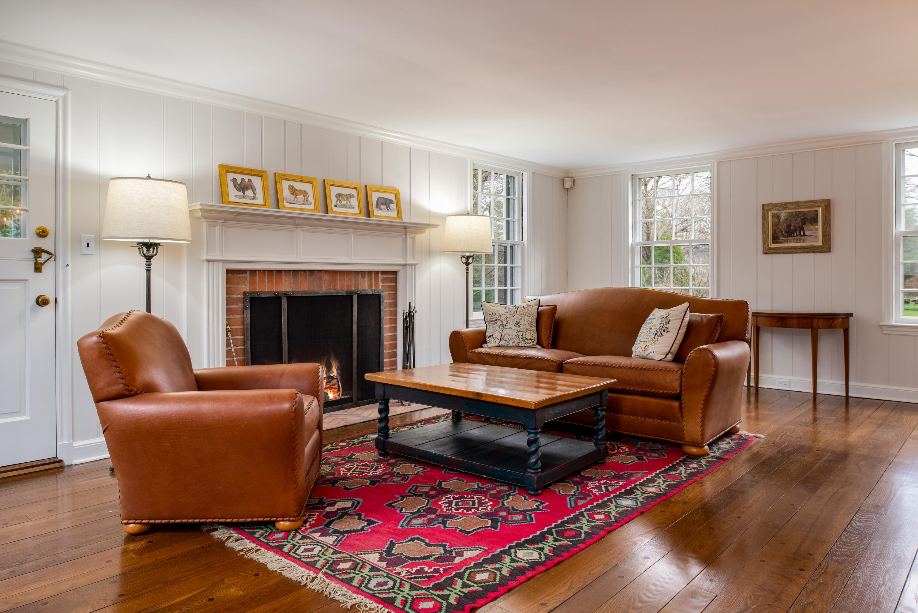 41 St Nicholas Road Darien, CT 06820 - Photo 4 of 39 a living room with furniture and a fireplace