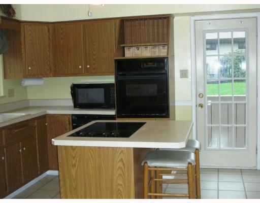 258 Kaufman Road Gibsonia, PA 15044 - Photo 5 of 14 Kitchen. Kitchen features a center island with electric cook top. There is also a seperate entry into the house from the kitchen.