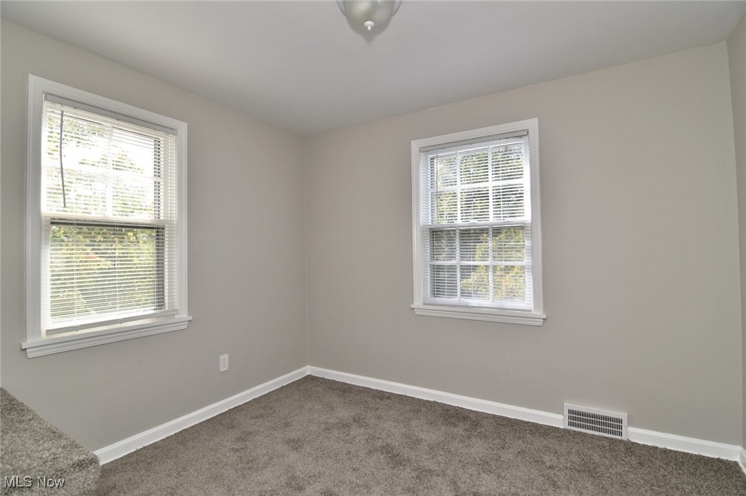 1443 Churchill Road Lyndhurst, OH 44124 - Photo 33 of 39 Spare room featuring baseboards and carpet