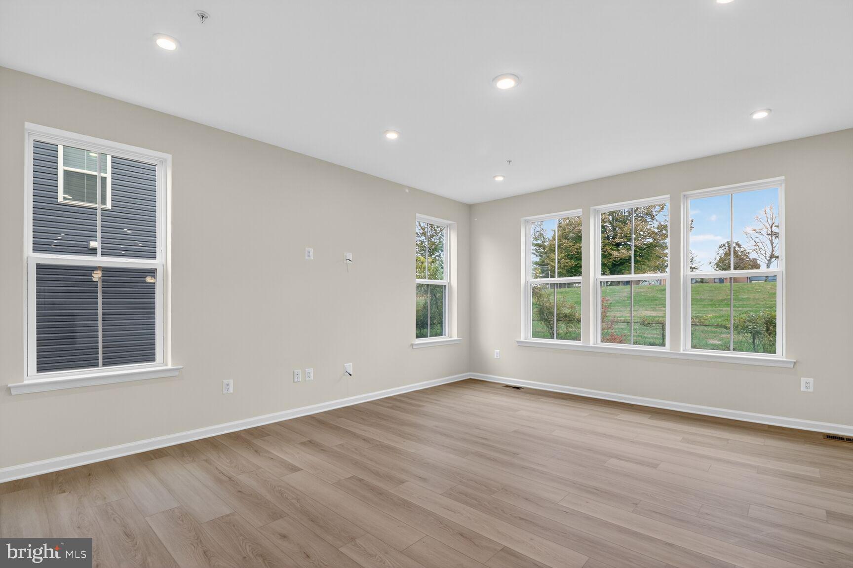 4014 Millner Road Nottingham, MD 21236 - Photo 13 of 15 a view of empty room with wooden floor and fan