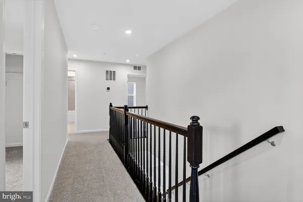 a view of a hallway with a staircase