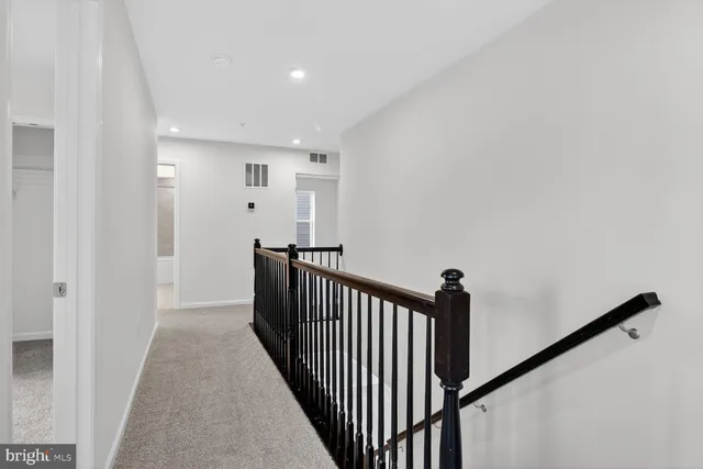 a view of a hallway with a staircase