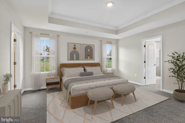 a bedroom with a bed and a couch