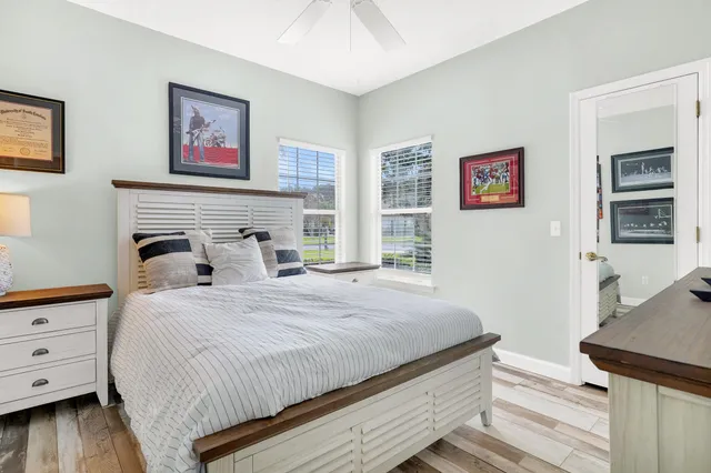 a bedroom with a bed and a dresser