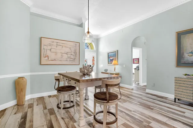 a view of a dining room with furniture and wooden floor