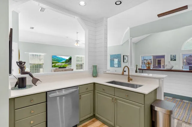 a kitchen with a sink and cabinets
