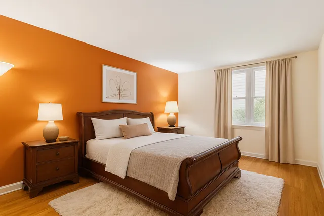 a bedroom with a bed and lamp with window