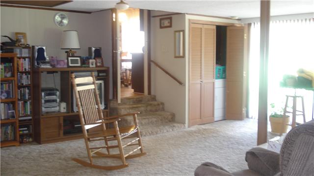 281 Doak Road Manchester, TN 37355 - Photo 18 of 20 Family Room with a view of stairs leading into kitchen and the double sliding doors.