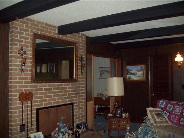 281 Doak Road Manchester, TN 37355 - Photo 7 of 20 Enter the Double Doors in Front into 17x18 Living Room with the Wood Burning Fireplace being the Focall Point.