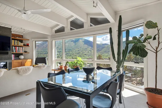 a view of a chairs and table in the balcony