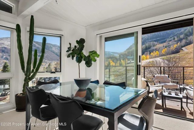 a kitchen with stainless steel appliances granite countertop a sink a stove top oven a counter space and cabinets