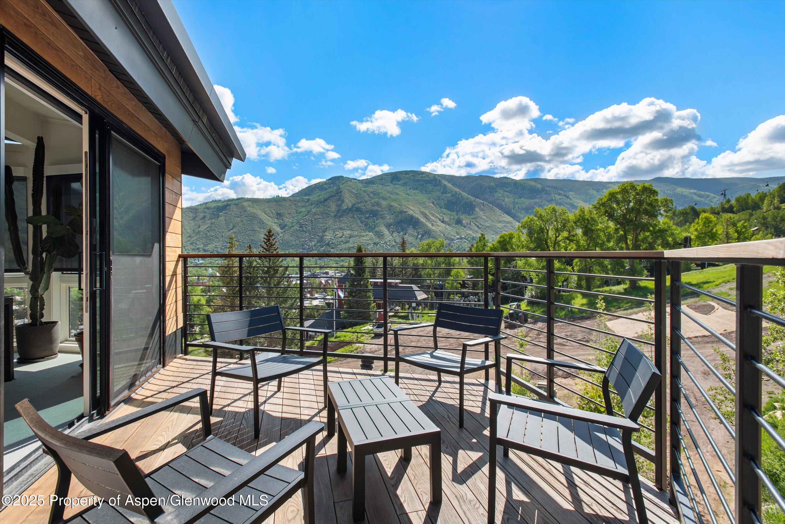 809 South Aspen Street, Unit 17 Aspen, CO 81611 - Photo 17 of 34 a view of a chairs and table in the balcony